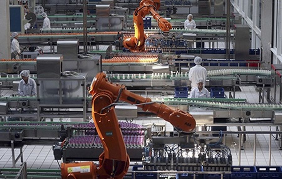 Employees work inside a milk factory in Beijing.